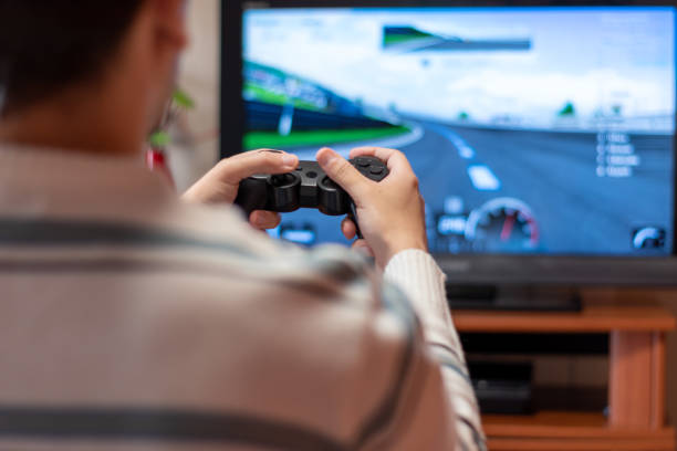 Man playing with game console at home. Concept of playing with the console